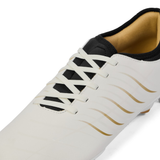 Close-up of the Canterbury Phoenix 2.0 Team SG rugby boot by Canterbury in white, featuring gold accents, white laces, a black tongue, and tan lining.