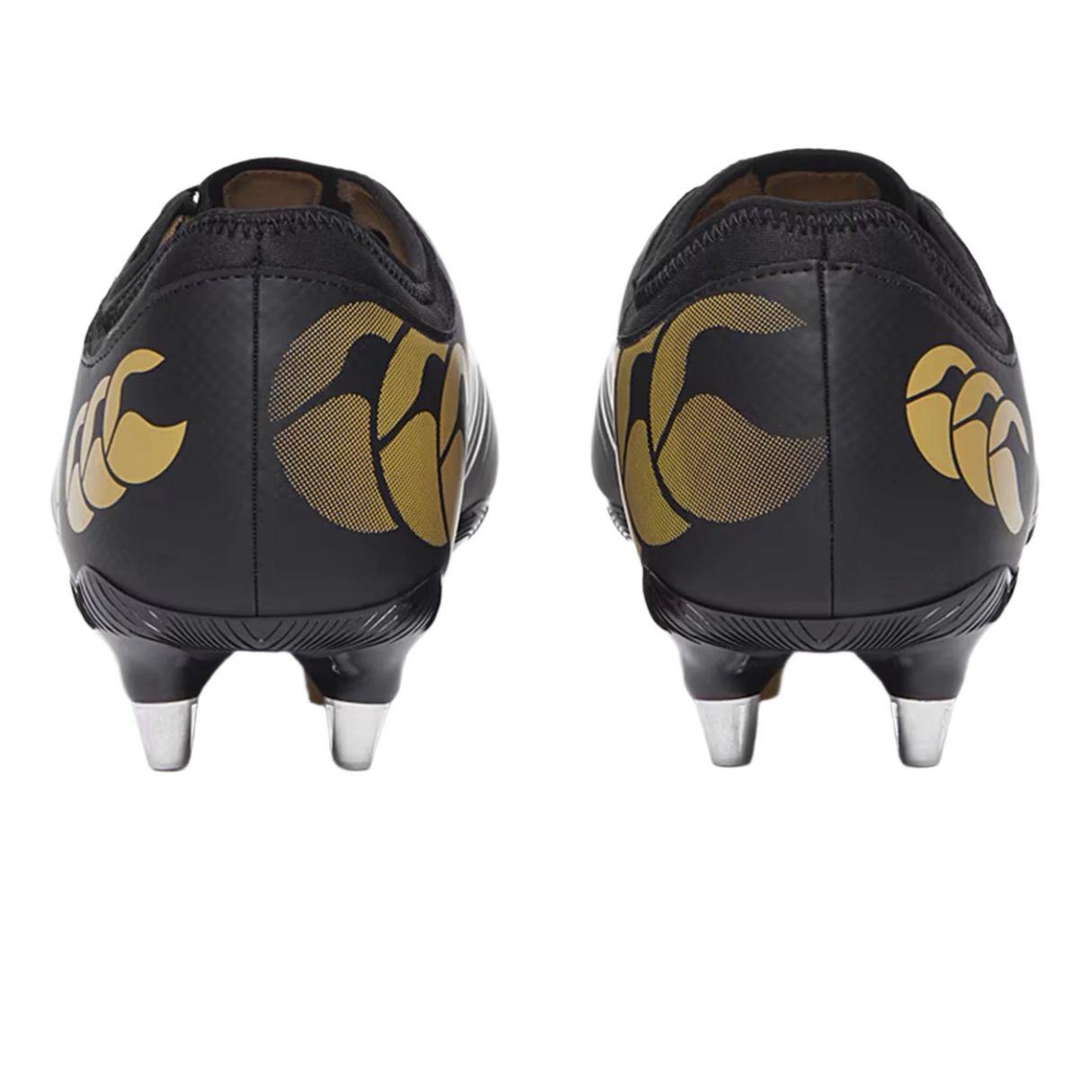 A pair of Canterbury Phoenix 2.0 Team SG - Black rugby boots by Canterbury, seen from the back, with black uppers, gold heel logos, and metal studs designed for soft ground.