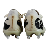 Rear view of Canterbury Speed Falcon Elite SG rugby boots in white, featuring metal studs and black patterns—ideal soft ground boots for dynamic play.
