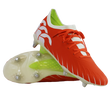 The Canterbury Speed Falcon Elite SG rugby boots in Tangerine Tango/Snow White feature metal studs, white accents and laces, a white and green inner lining, and are shown on a white background.