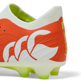 Close-up of the Canterbury Speed Falcon Elite FG in Tangerine Tango/Snow White, highlighting lime green and white sole studs—a top choice for players wanting lightweight football boots.