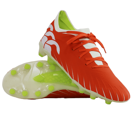 A pair of Canterbury Speed Falcon Elite FG football boots in Tangerine Tango/Snow White, featuring white accents, neon green studs, and white laces, displayed on a white background.