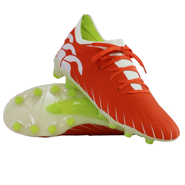 A pair of Canterbury Speed Falcon Elite FG football boots in Tangerine Tango/Snow White, featuring white accents, neon green studs, and white laces, displayed on a white background.