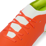 Close-up of Canterbury Speed Falcon Pro SG boots in Tangerine Tango/Snow White, featuring a white tongue, tangerine laces, and a green inner lining—lightweight rugby boots from Canterbury designed for agile performance.