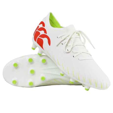 A pair of Canterbury Speed Falcon Pro FG soccer cleats in Snow White/Tangerine Tango with green studs, one upright and one on its side, showcasing the heel's Tangerine Tango design.