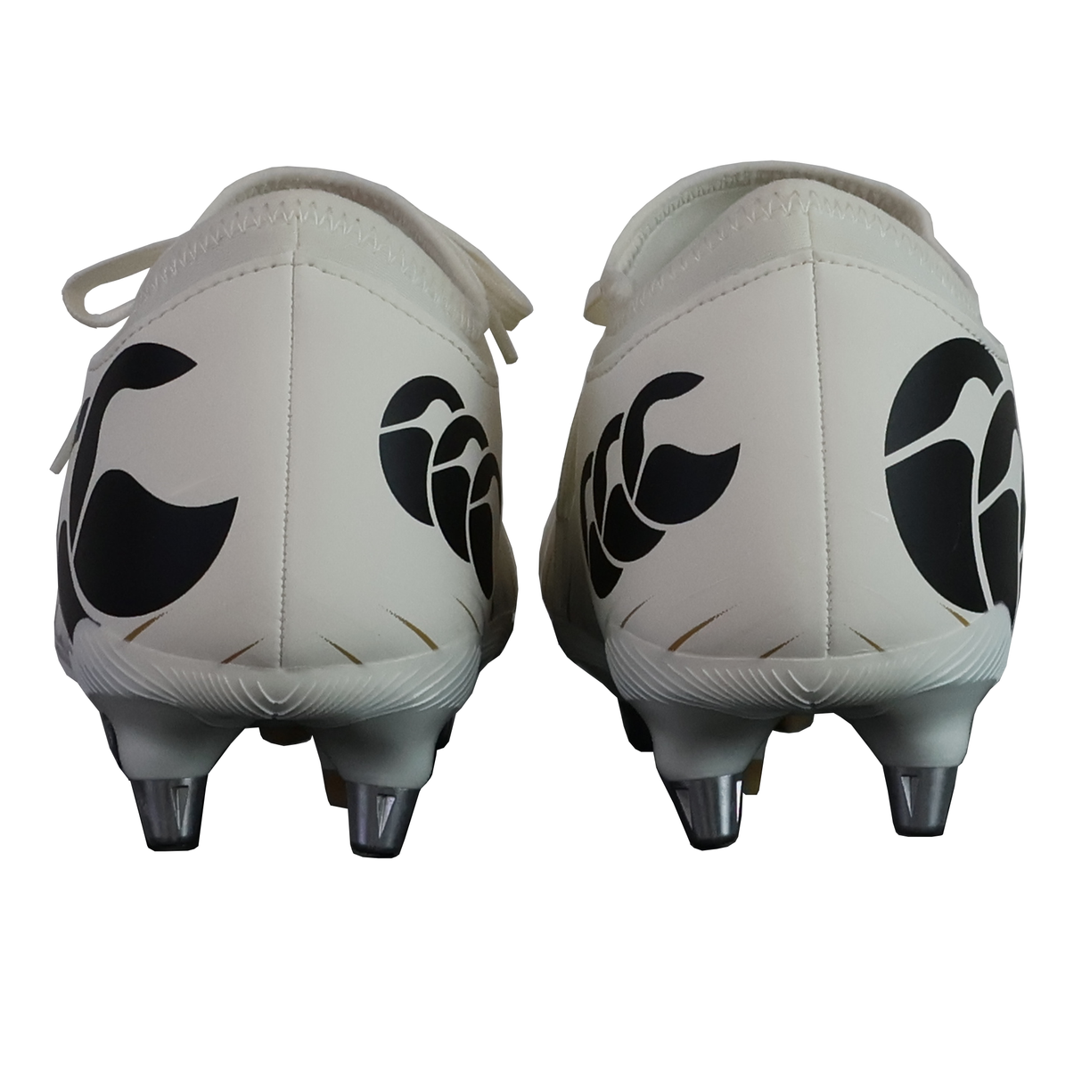 The Canterbury Speed Falcon Team SG - White rugby boots by Canterbury feature black abstract heel designs. Ideal soft ground boots for agile players, offering a blend of style and performance.