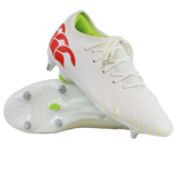 A pair of Canterbury Speed Falcon Team SG soccer cleats in Snow White/Tangerine Tango, featuring a red logo, neon green interior, and metal studs; one shoe stands upright while the other shows its sole.