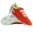 A pair of Canterbury Speed Falcon Team SG rugby boots in Tangerine Tango/Snow White, one upright and one on its side, featuring metal studs and a lime green inner lining.