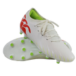 A pair of Canterbury Speed Falcon Team FG soccer cleats in Snow White/Tangerine Tango, featuring green studs, a lime green interior, and tangerine red heel accents, displayed against a white background.
