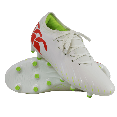 A pair of Canterbury Speed Falcon Team FG soccer cleats in Snow White/Tangerine Tango, featuring green studs, a lime green interior, and tangerine red heel accents, displayed against a white background.