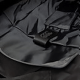 A close up of a Canterbury Medium Backpack with a cell phone in it.