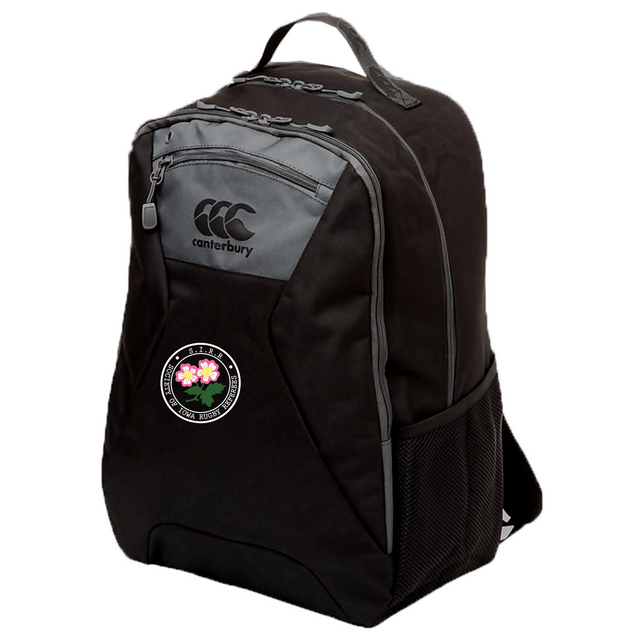 A black Society of Iowa Rugby Referees Medium Backpack by EMB Canterbury with gray zippers and a mesh side pocket, featuring a round patch with pink flowers and text on the front. This water repellent backpack also includes a padded laptop pocket for added protection and convenience.