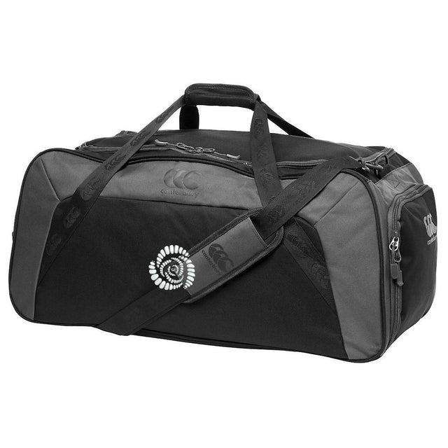 The Missoula All-Maggots Holdall Duffle Bag by EMB Canterbury features a black and gray design with dual handles, a shoulder strap, zippered pockets, and a small white circular logo on the strap. This rugby bag is water repellent, ensuring your gear stays protected in any weather.
