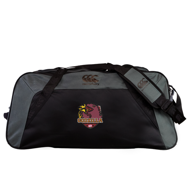 The Godzilla Rugby Football Club Holdall Duffle Bag by Canterbury, from EMB Canterbury, is a black and gray water-repellent duffle bag featuring a striking Godzilla logo and the word “GODZILLA” across the front, topped with the iconic Canterbury logo. This stylish holdall offers durability and an attention-grabbing design—perfect for rugby players on the go.