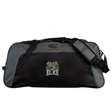 The Lewis County Elks Holdall Duffle Bag by EMB Canterbury is a black and gray rugby bag featuring an “Elks” logo with antlers on the front, crafted from water-repellent material and equipped with sturdy handles and a comfortable shoulder strap.