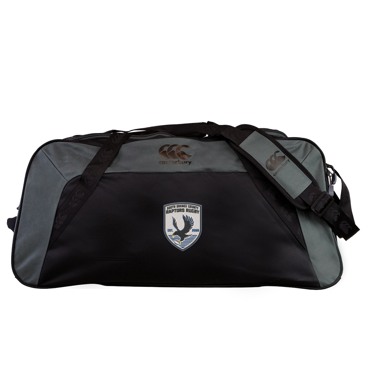 The South Orange County Raptors Holdall Duffle Bag by EMB Canterbury is a black and gray water-repellent sports bag with shoulder straps, featuring the Canterbury logo and an embroidered South Orange County Raptors eagle patch with text on the front.