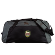 The EMB Canterbury RVA T.R.C. Holdall Duffle Bag by Canterbury is a large black and gray duffle bag featuring a shoulder strap and an RVA FC crest on the front. Water-repellent and ideal for carrying your rugby essentials, it is shown on a plain white background.