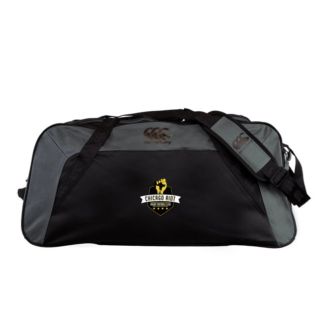 The Chicago Riot Holdall Duffle Bag by Canterbury, from EMB Canterbury, features a black and gray design, front "Chicago Riot Softworks" logo, padded shoulder strap, and water-repellent material for added durability.