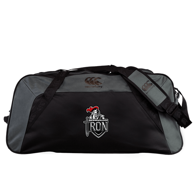 The Birmingham Iron Women's Football Holdall Duffle Bag by EMB Canterbury is a large, water-repellent black and gray duffle, ideal for rugby, featuring the Canterbury logo and an embroidered "IRON" emblem with a knight in armor.
