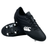 The Canterbury Junior Raze SG Boot in black and white features metal studs and a side logo, shown with one boot upright and the other displaying the sole.