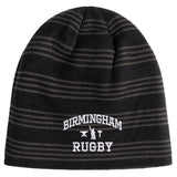 A black and gray striped Birmingham Rugby Text Logo Beanie by Canterbury, featuring “Birmingham Rugby” and two crossed rugby posts embroidered in white on the front, from EMB Canterbury.
