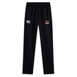 The Southern Pines Youth Rugby Stretch Tapered Pant by EMB Canterbury features a black design with an elastic waistband, a white logo on the left, and a red, black, and white crest on the right, combining comfort and style for any active occasion.