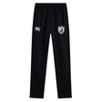 The South Orange County Raptors Stretch Tapered Pant by EMB Canterbury are black men’s workout pants featuring an elastic waistband, the iconic white Canterbury logo on the left, and a shield-shaped patch with a bird and text on the right thigh. Designed for comfort and performance, these quick-dry training pants are ideal for your next session.