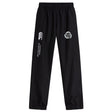 Introducing the Missoula All-Maggots Cuffed Hem Stadium Pant by EMB Canterbury—these black athletic track pants feature an elastic waistband and cuffs, with white printed logos on both the left and right thighs. Inspired by classic men's stadium pants, this EMB Canterbury design effortlessly combines comfort and style, making it perfect for active days or relaxed downtime.