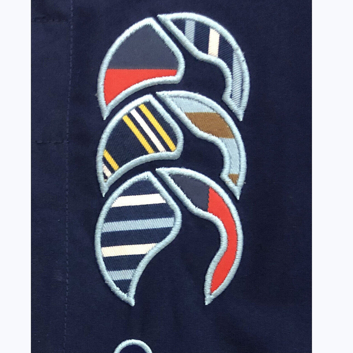 A close up of a Canterbury shirt with a design on it.