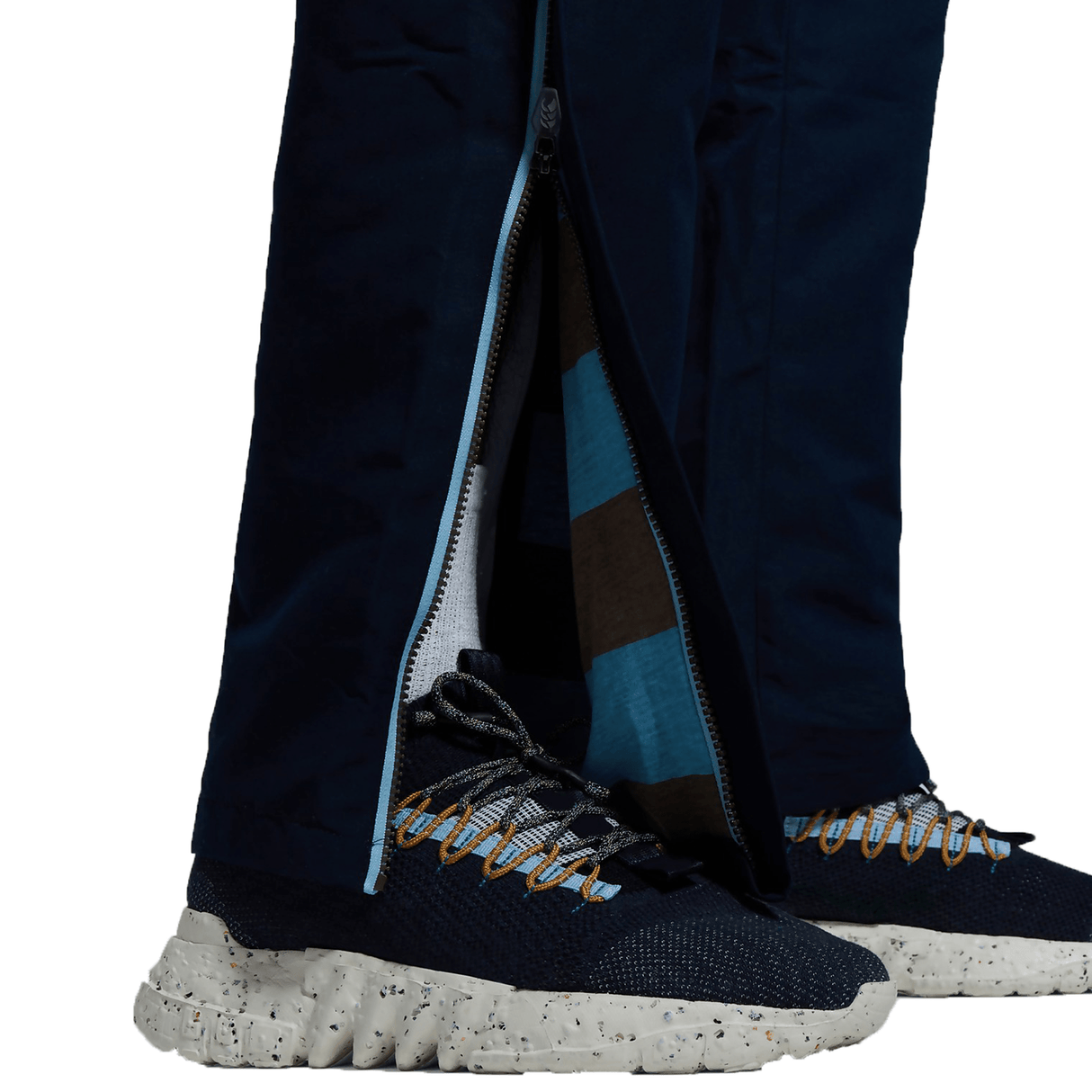 A person's legs with a pair of Canterbury CCC Uglies Open Hem Stadium Pants on top of them.