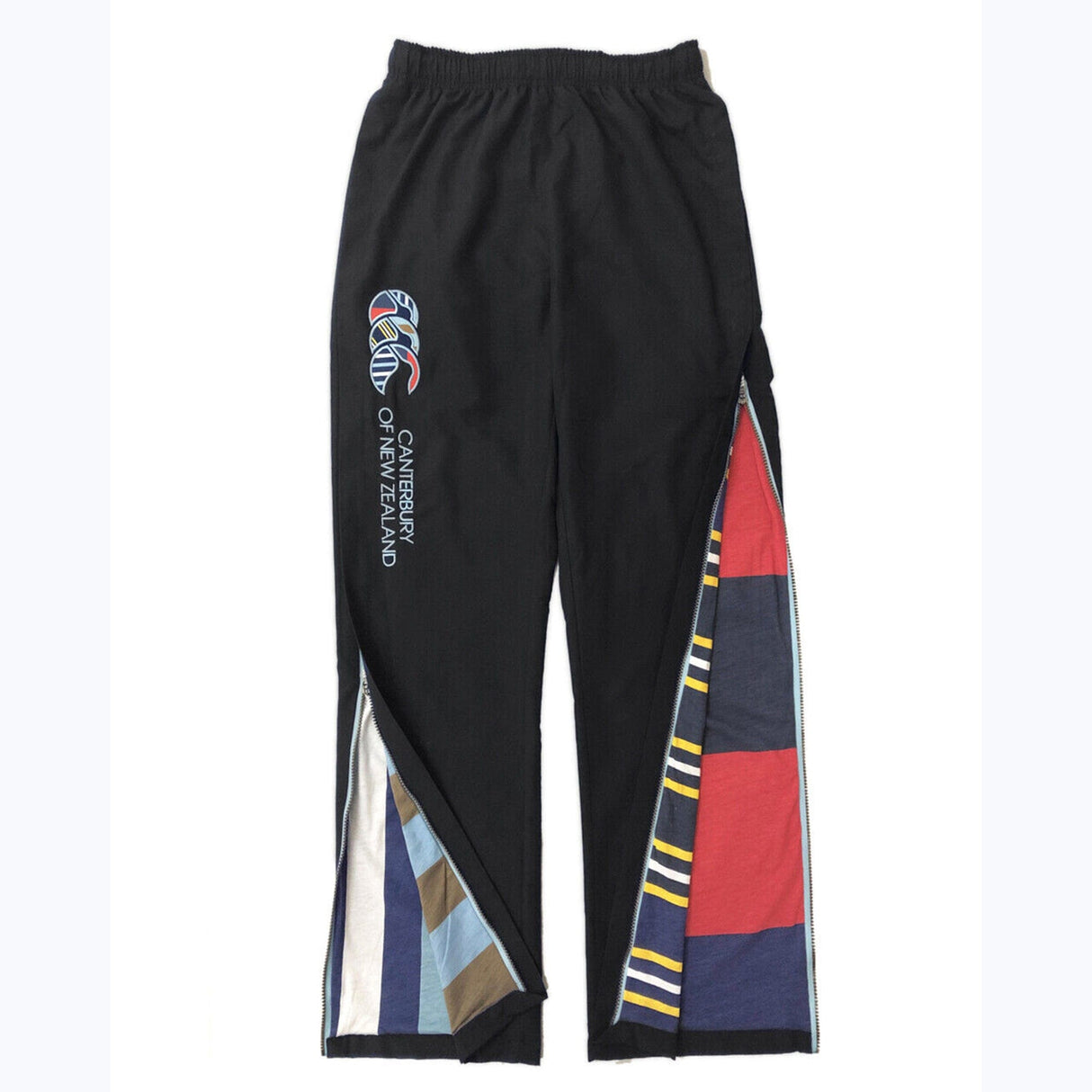 A pair of Canterbury CCC Uglies Open Hem Stadium Pants with multicolored patches.