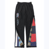 A pair of Canterbury CCC Uglies Open Hem Stadium Pants with multicolored patches.