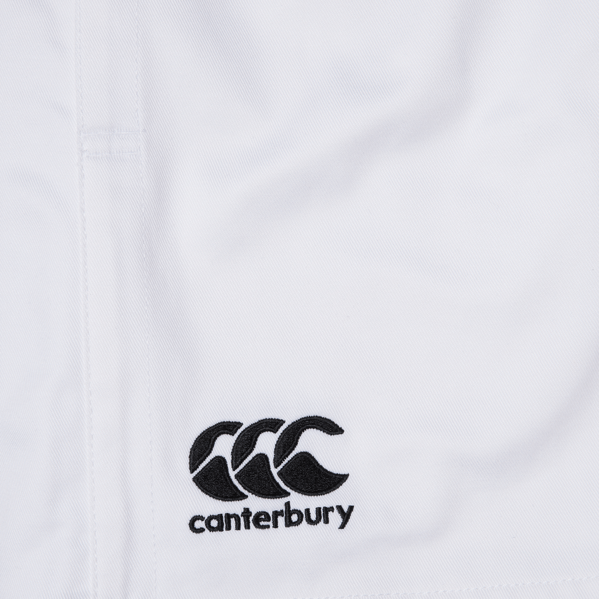The Canterbury Professional Cotton Short 3-Pack by Bundle Canterbury features white cotton shorts with an elastic waistband and an embroidered black logo of three intertwined C's above "canterbury.