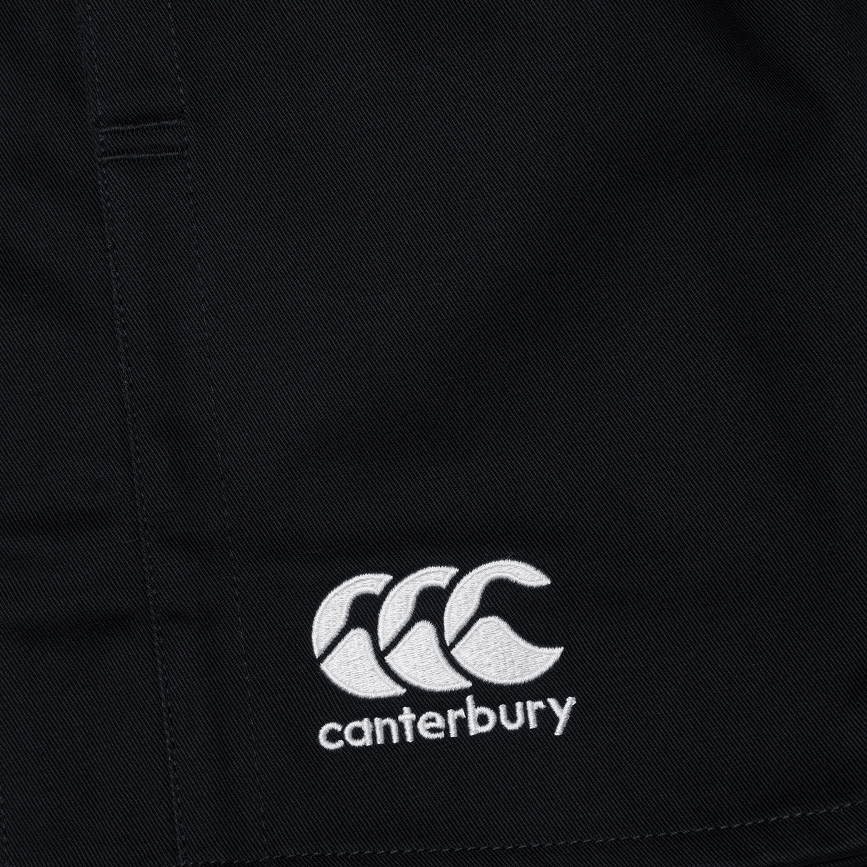 A close up of the Canterbury logo on a black short.