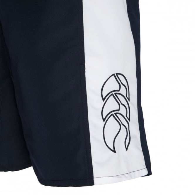 Close-up of black Canterbury Panelled Tactic Shorts featuring a white side panel with the embroidered Canterbury logo, comprised of three overlapping leaf-like shapes. Made from moisture-wicking polyester taslon, these shorts are perfect for staying cool and comfortable.
