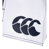 a white Canterbury bag with a black logo on it.