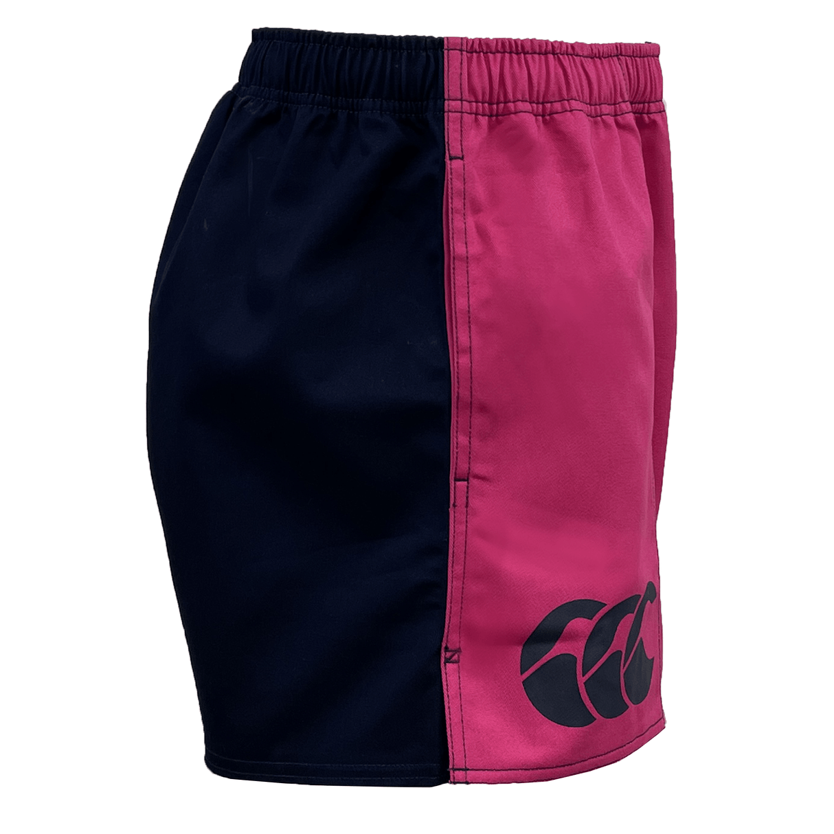 Side view of a pair of Canterbury Classics Harlequin Cotton Shorts featuring a two-tone design, with the left side in black and the right side in pink, along with a logo on the pink side.