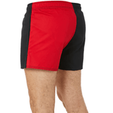 A man wearing Canterbury Classics Harlequin Cotton Shorts in red and black.