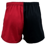 A pair of Canterbury Classics Harlequin Cotton Shorts from Canterbury, featuring a two-tone design with one red half and one black half, an elastic waistband, and mid-thigh length.