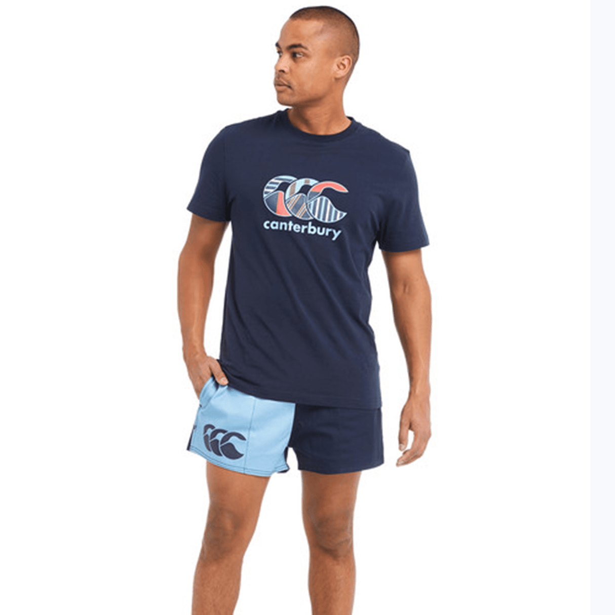 A man wearing Canterbury Classics Harlequin Cotton Shorts and a blue shirt.