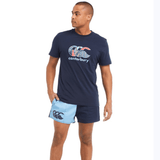 A man wearing Canterbury Classics Harlequin Cotton Shorts and a blue shirt.