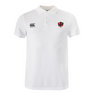 The Southern Pines Youth Rugby Waimak Polo by EMB Canterbury is a white polo shirt with a collar and buttons made from a comfy cotton-polyester blend. It features a black and red shield logo on the left side and Canterbury's iconic logo on the right.
