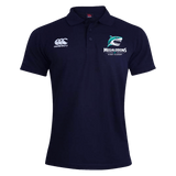 The NC Rugby Academy - Megalodons Waimak Polo by EMB Canterbury is a navy blue short-sleeve polo featuring white "Canterbury" branding and a shark logo on the chest—ideal for any rugby fan.