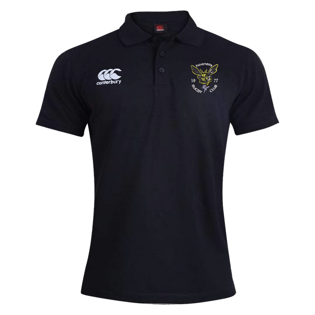 The EMB Canterbury Hornets Rugby Club 1977 Waimak Polo is a classic black short-sleeve rugby polo featuring the Canterbury logo on the right chest and a yellow embroidered Hornets Rugby Club crest on the left chest, perfect for both fans and players.