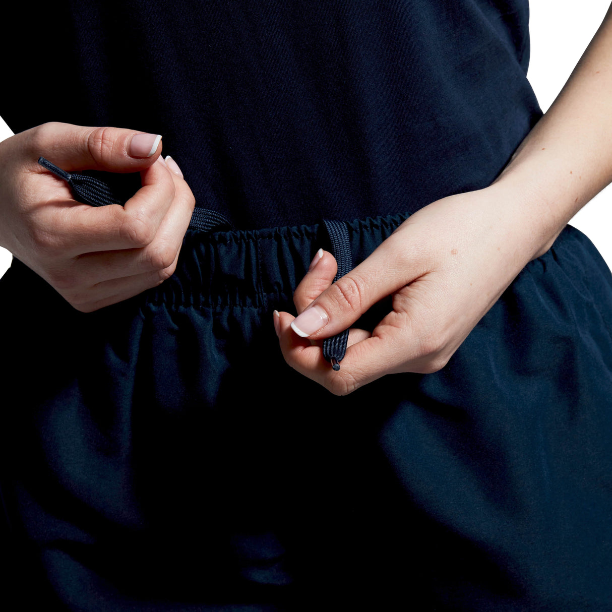 A close-up shows drawstrings being tied on the Women's Canterbury Open Hem Stadium Pant, featuring the Canterbury logo, ready for a rigorous rugby training session.