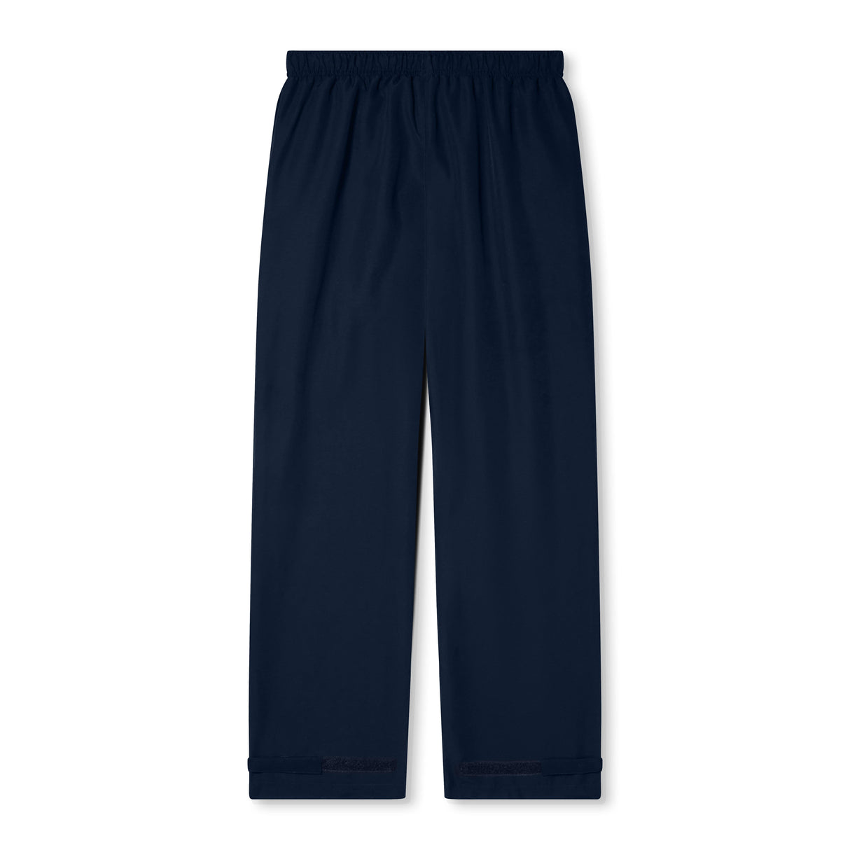 The Women's Canterbury Open Hem Stadium Pant features a blue color, elastic waistband, and full-length leg zips—ideal for rugby training—and is showcased against a white background.