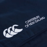 Close-up of a navy blue fabric with a white Canterbury logo and "Canterbury of New Zealand" text. Ideal for rugby training, the design features intricate details on the Women's Canterbury Open Hem Stadium Pant.