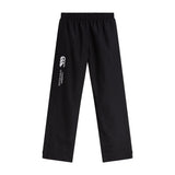 The Women's Canterbury Open Hem Stadium Pant features black athletic pants with an elastic waistband and the iconic Canterbury logo on the side. They're designed for comfort during rugby training and include convenient full-length leg zips.