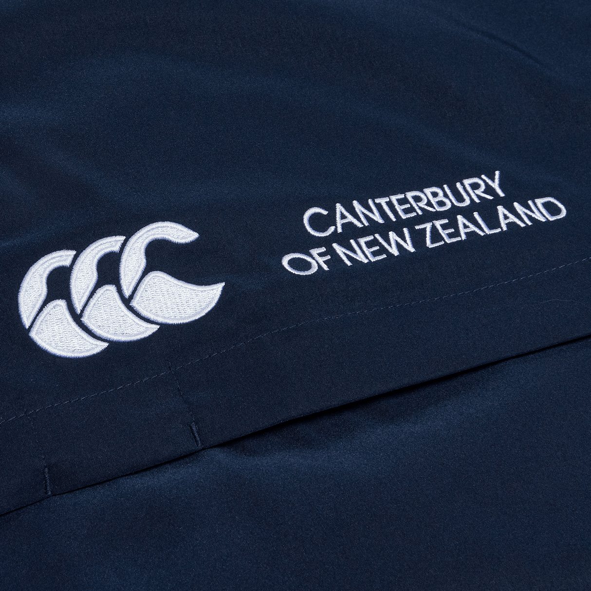 A close up of Canterbury Open Hem Stadium Pant with the Canterbury logo on it.