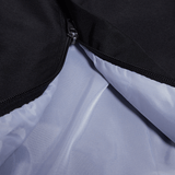 A close up of a black and white Canterbury Open Hem Stadium Pant.